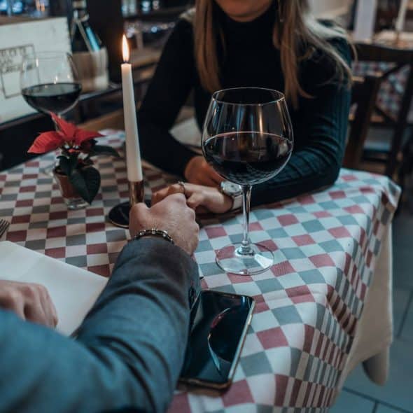 A man and woman having a dinner together.