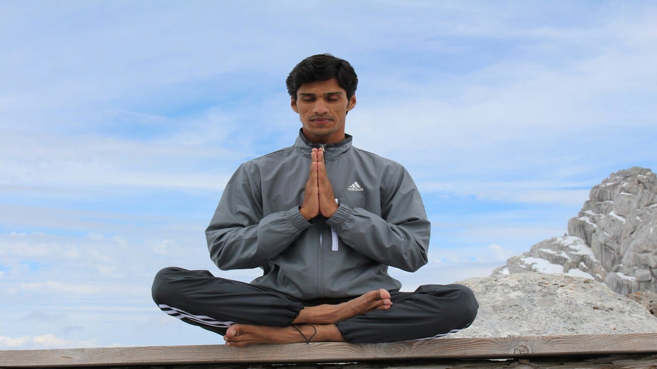 A man practicing yoga.