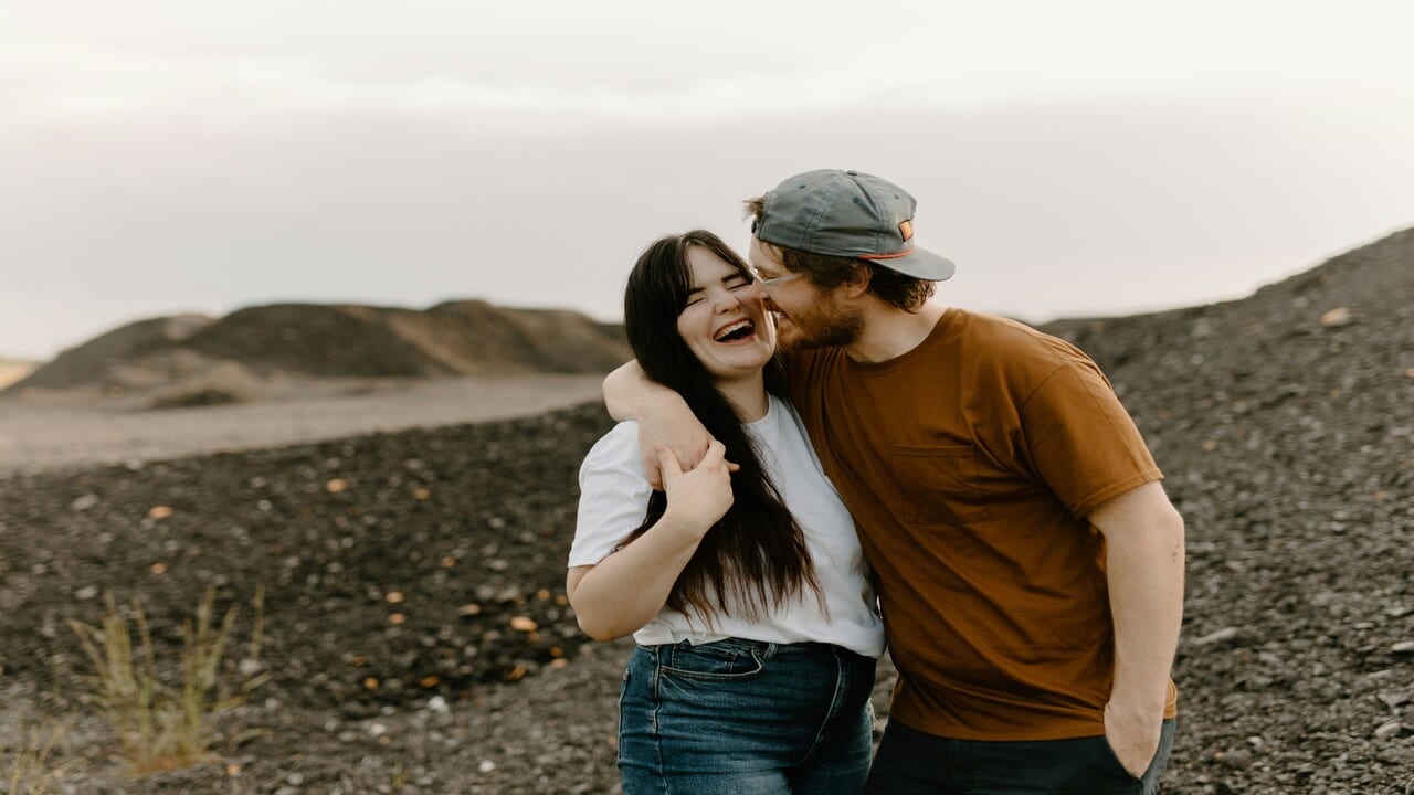 A couple laughing together.