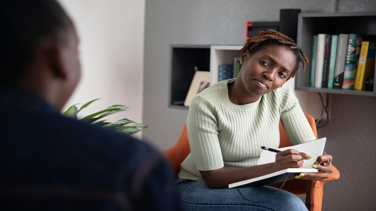 A therapist listening to a client.