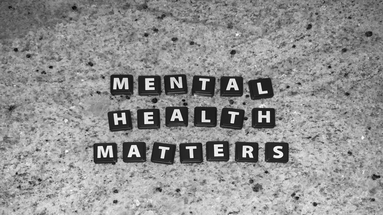 Tiles spelling out “mental health matters”.