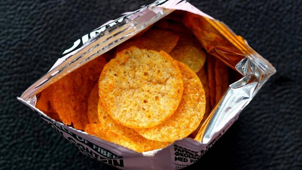 A bag of round, seasoned orange chips.