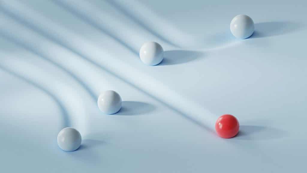 One white ball with red balls
