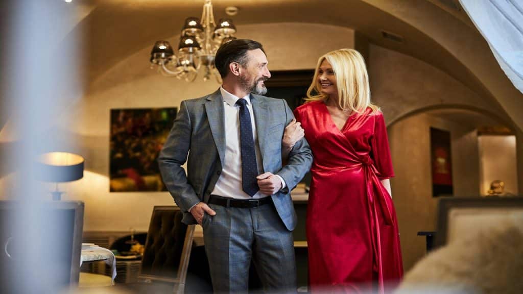 An elegant man and woman looking at each other