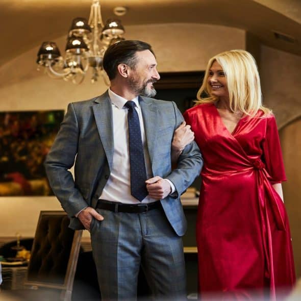 An elegant man and woman looking at each other