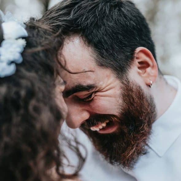 A couple smiling at each other