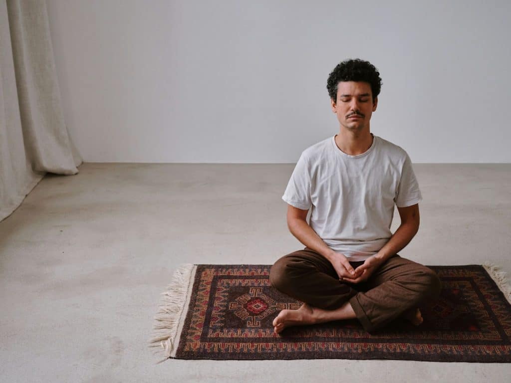 A man meditating.