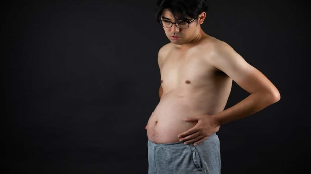 A man holding his tummy
