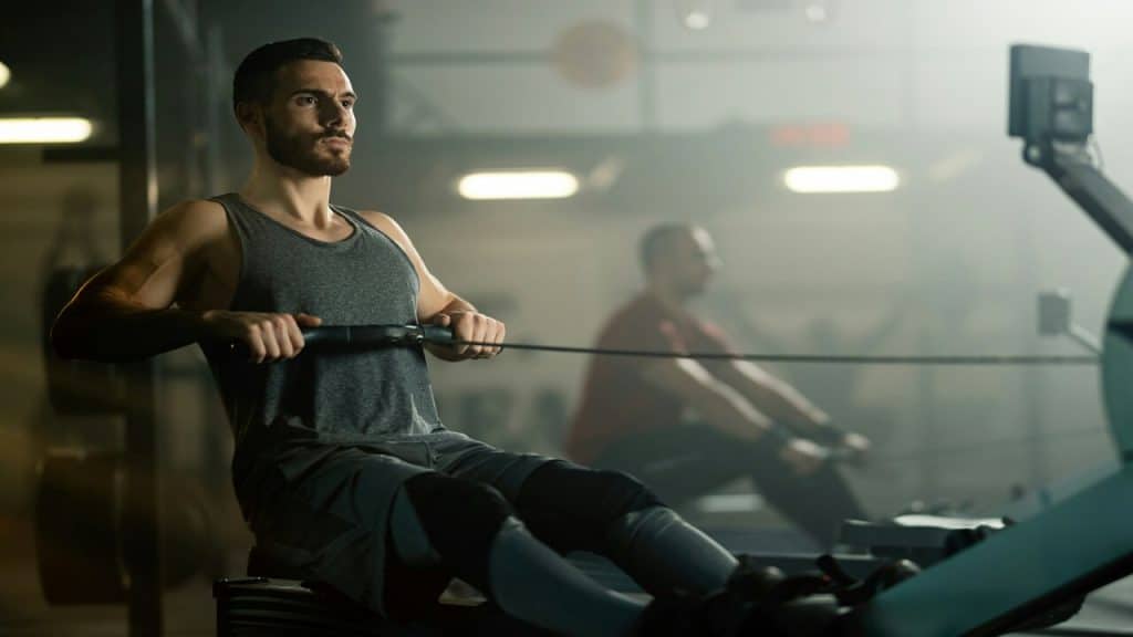A man using the rowing machine
