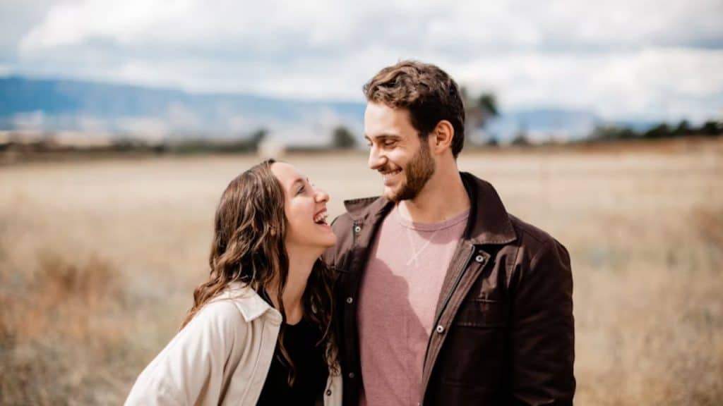 Couple laughing naturally during a walk