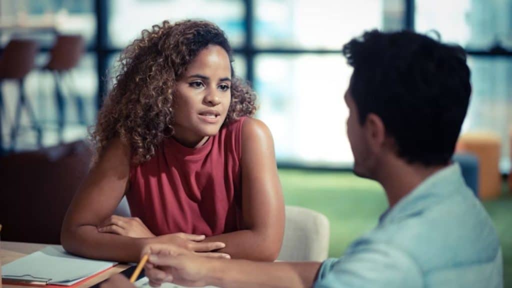 Man and woman cooperating during a moment that reflects effort and partnership