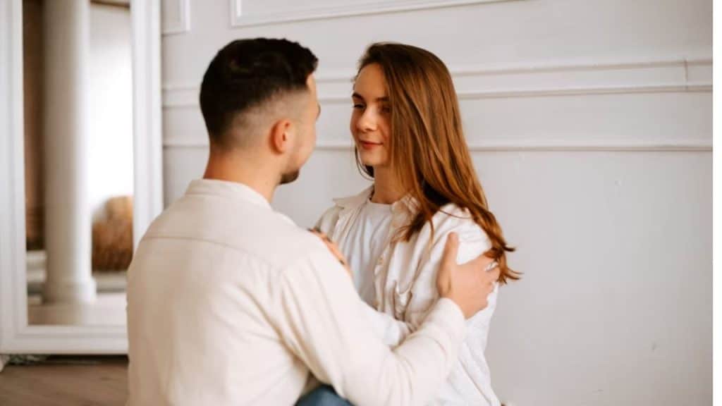 Couple locking eyes during a quiet, connected moment