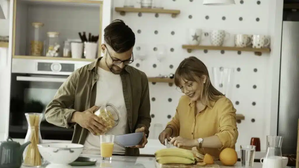 Man helping partner prepare  food for the day
