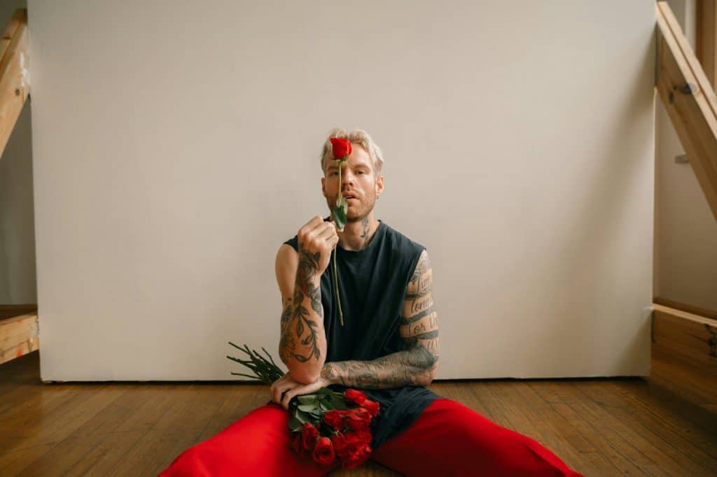 A man holding a rose