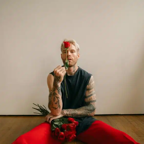 A man holding a rose