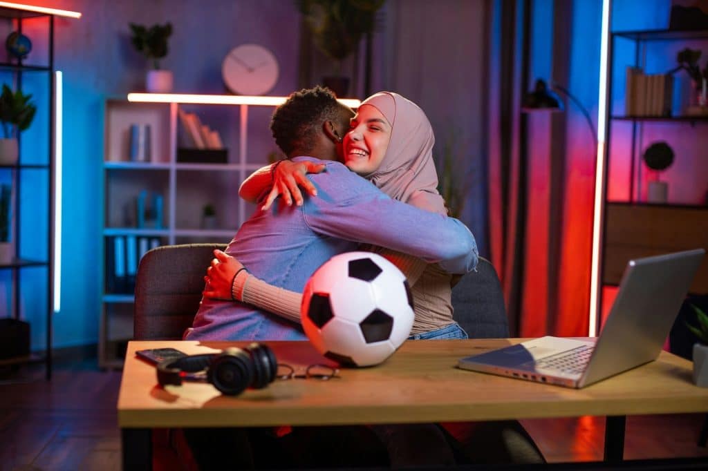 A man and woman hugging each other