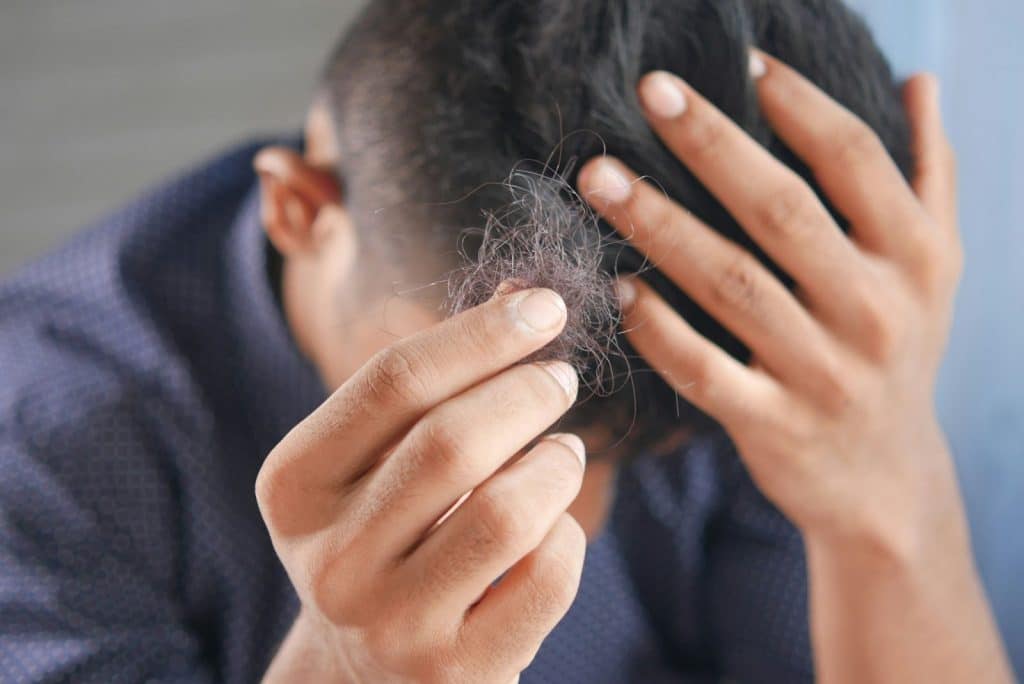 A man having troubles with his hair