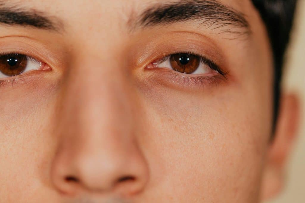 A close-up of manβs eyes