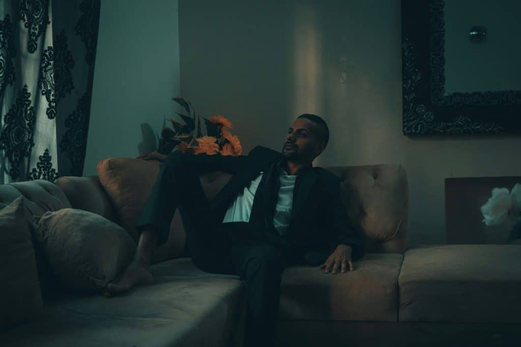 A man laying at the sofa