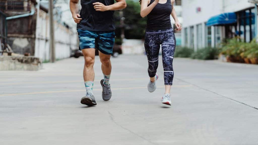 A couple running together.