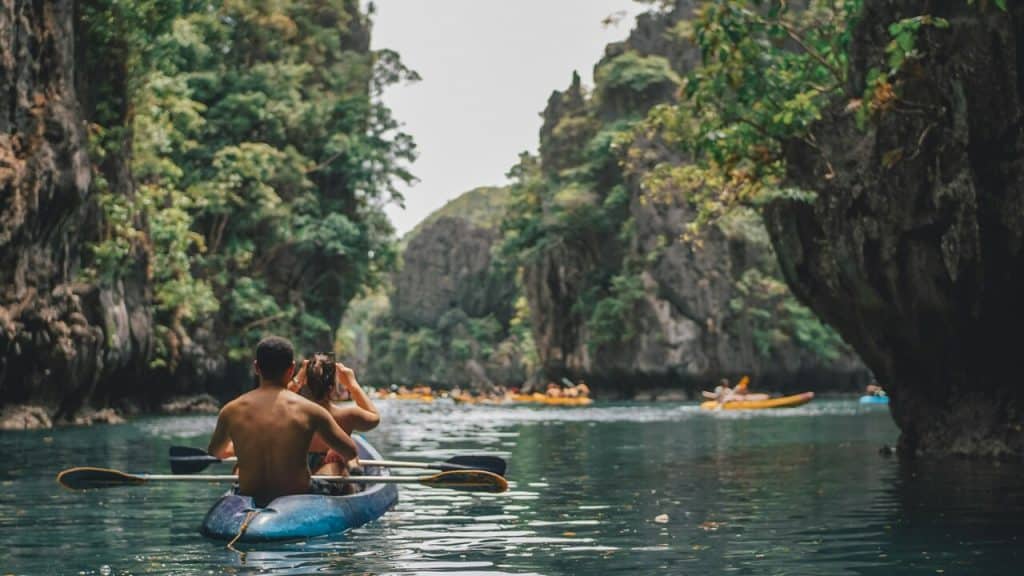 A couple kayaking on a river.