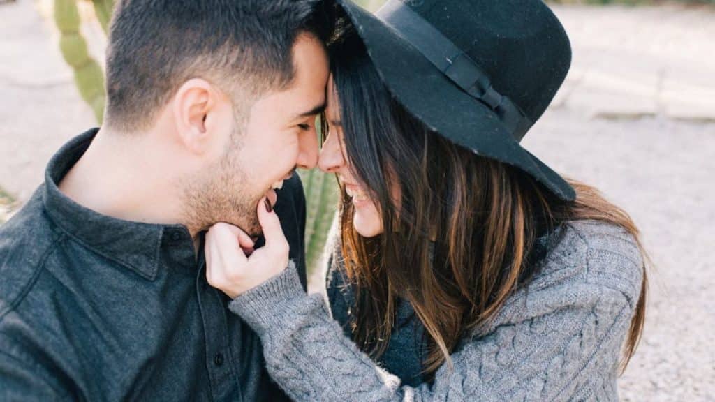 Couple hugging and smiling after reconnecting