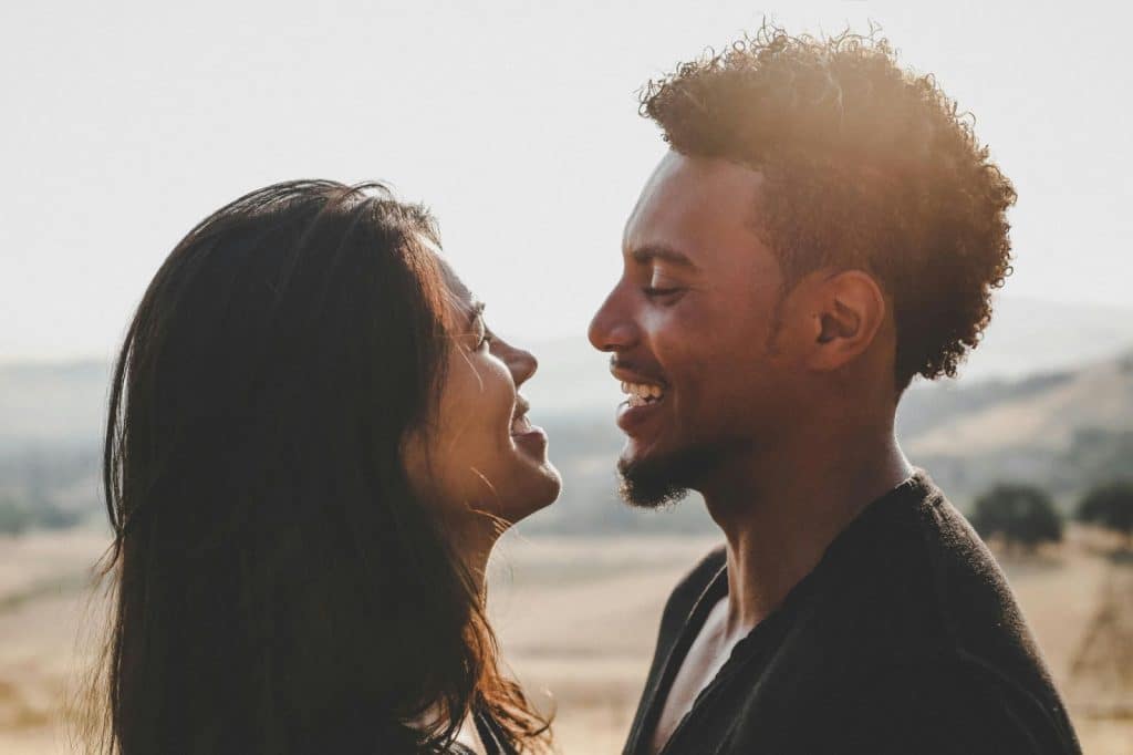 A man and woman smiling at each other