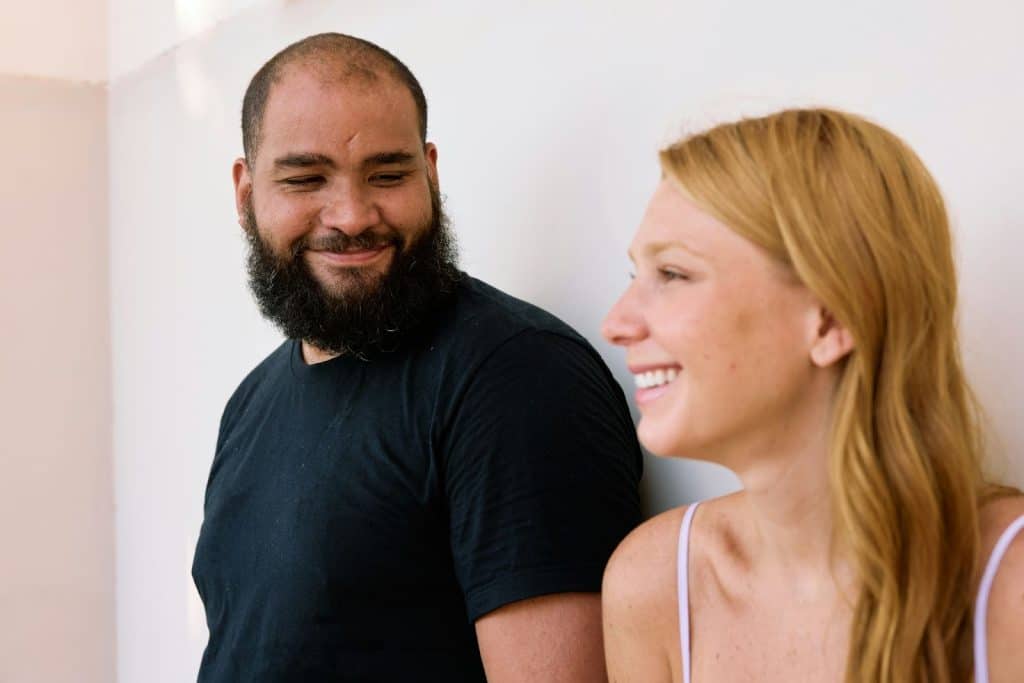 A man looking at the woman