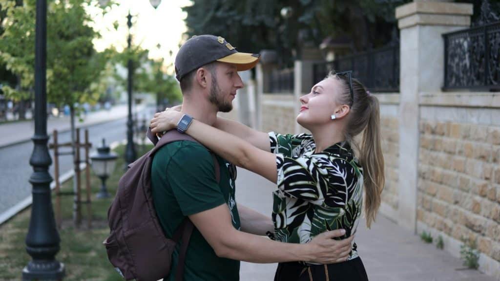 A man and woman facing each other