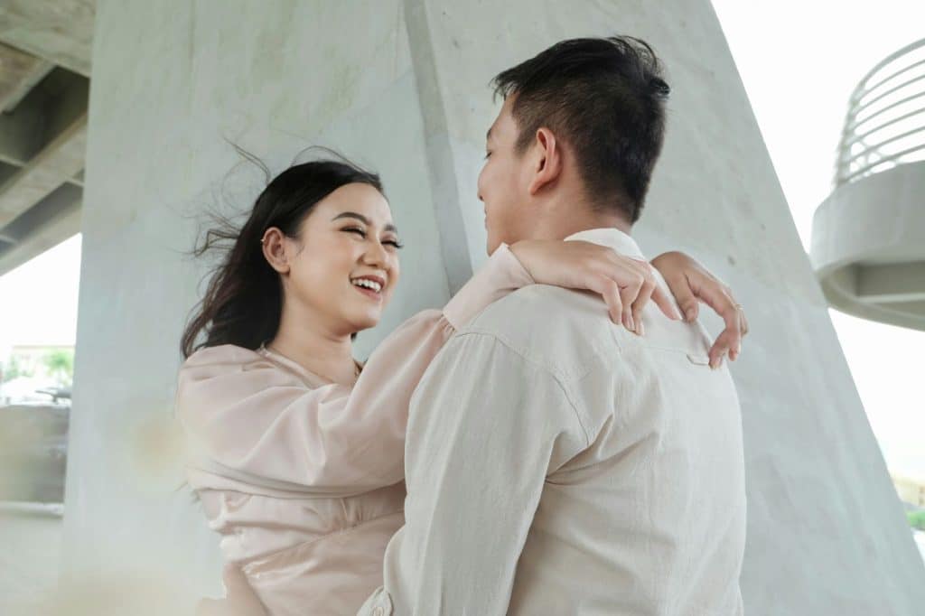 A man looking at the laughing woman