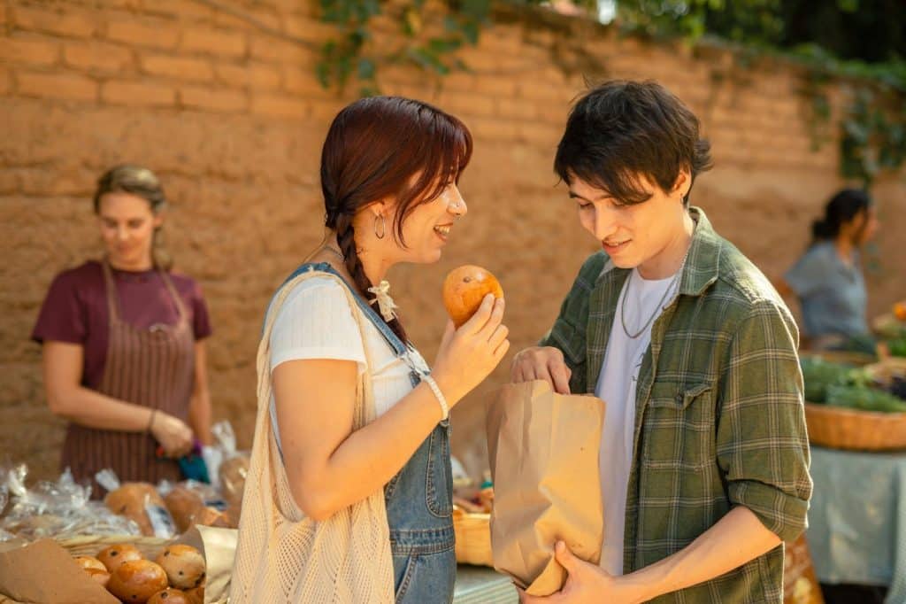 A man giving woman a snack