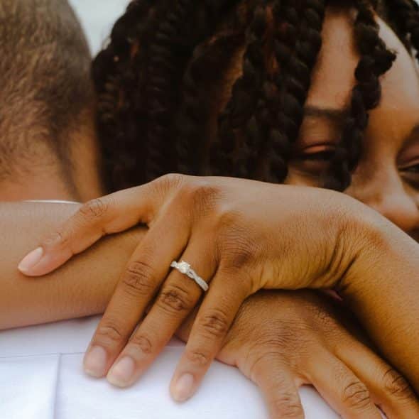 A woman hugging a man