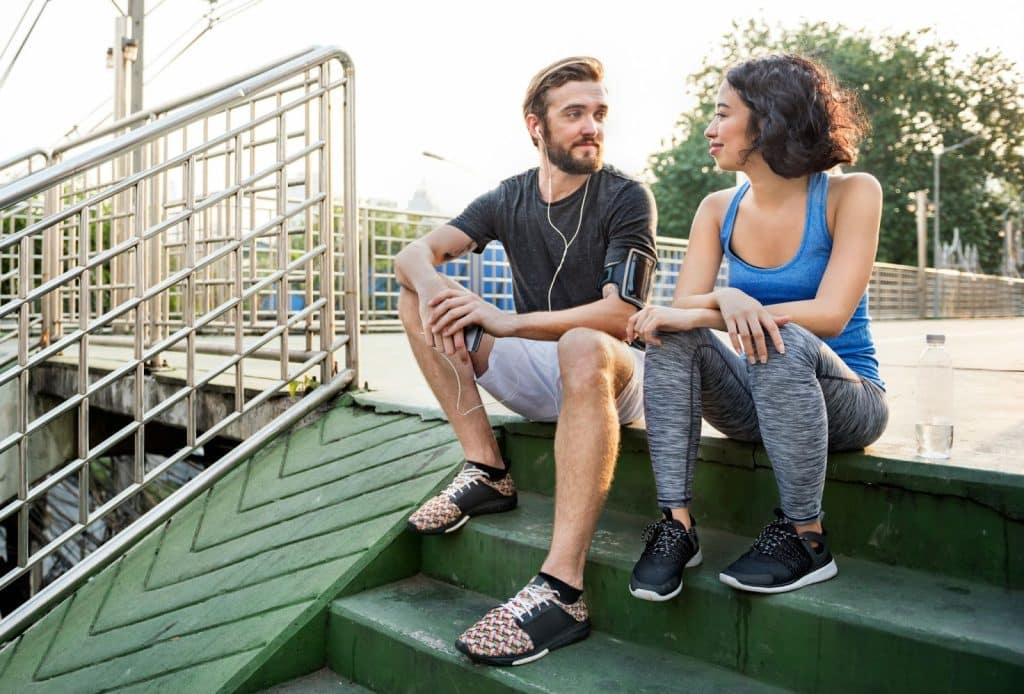 A man listening to a woman