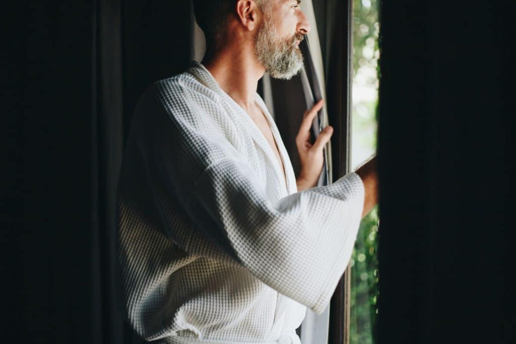 A man looking outside the window