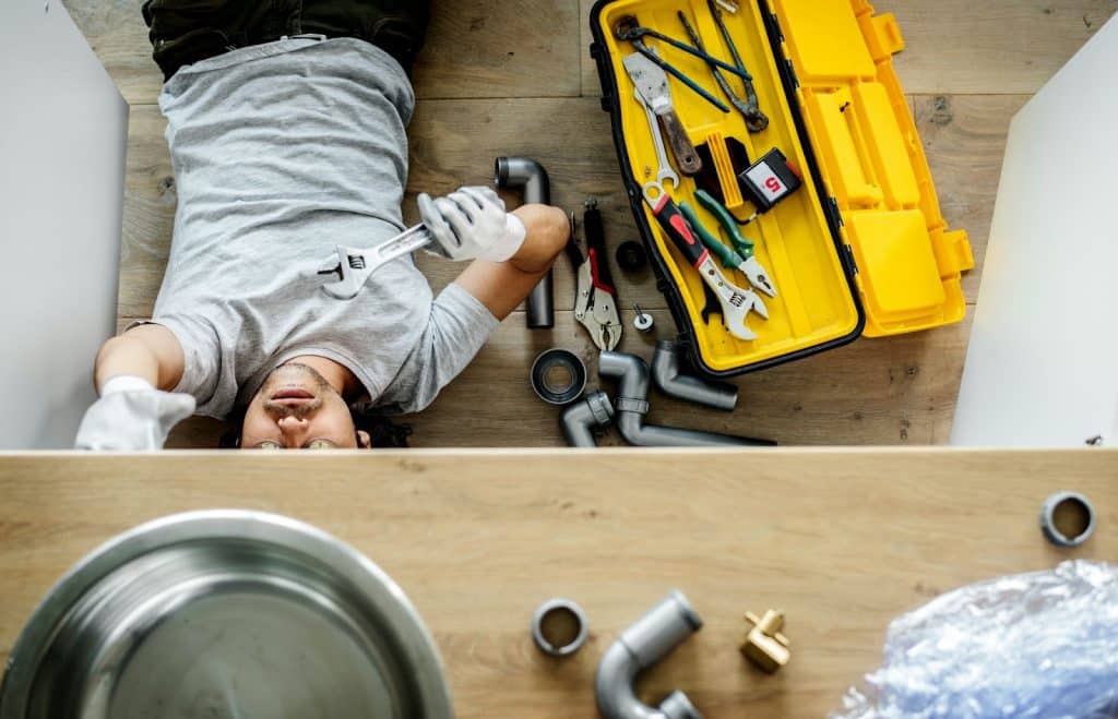 A man fixing something with his tools