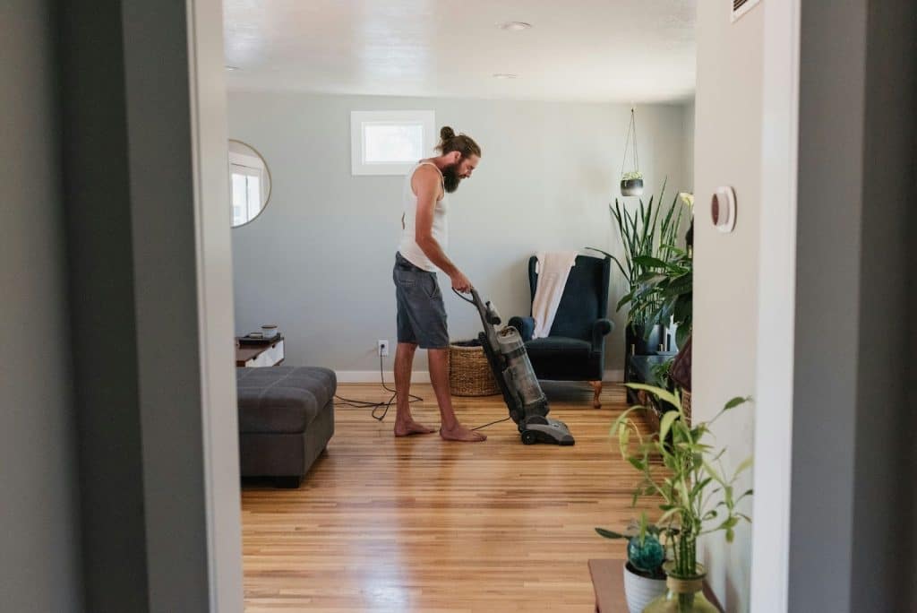 A man using a vacuum cleaner