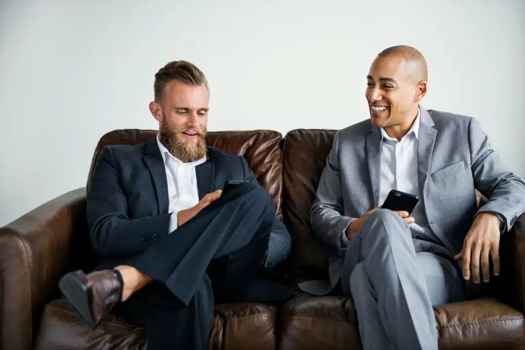 Two men sitting at the couch