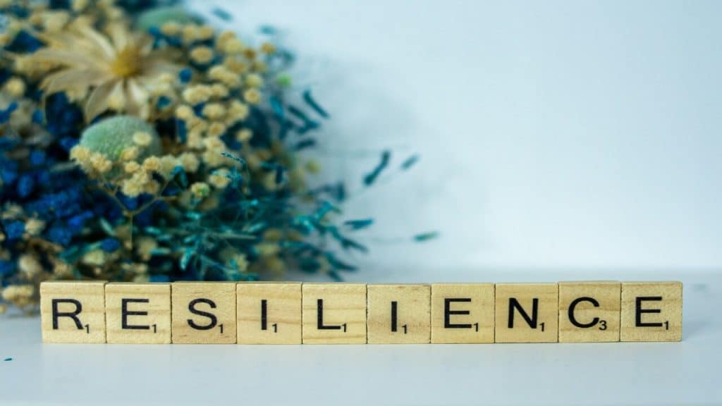 Wooden letters spelling out “resilience”.