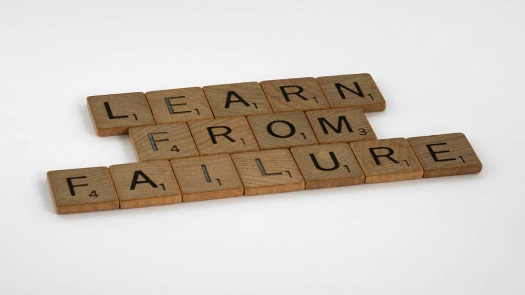 Wooden blocks spelling out “learn from failure”.