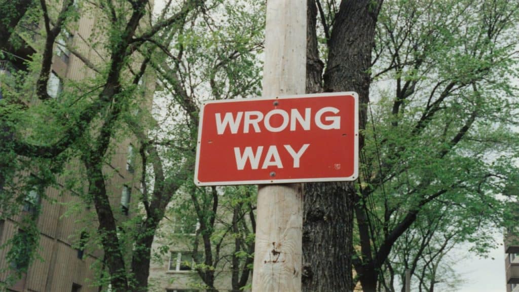 A street sign saying “wrong way”.