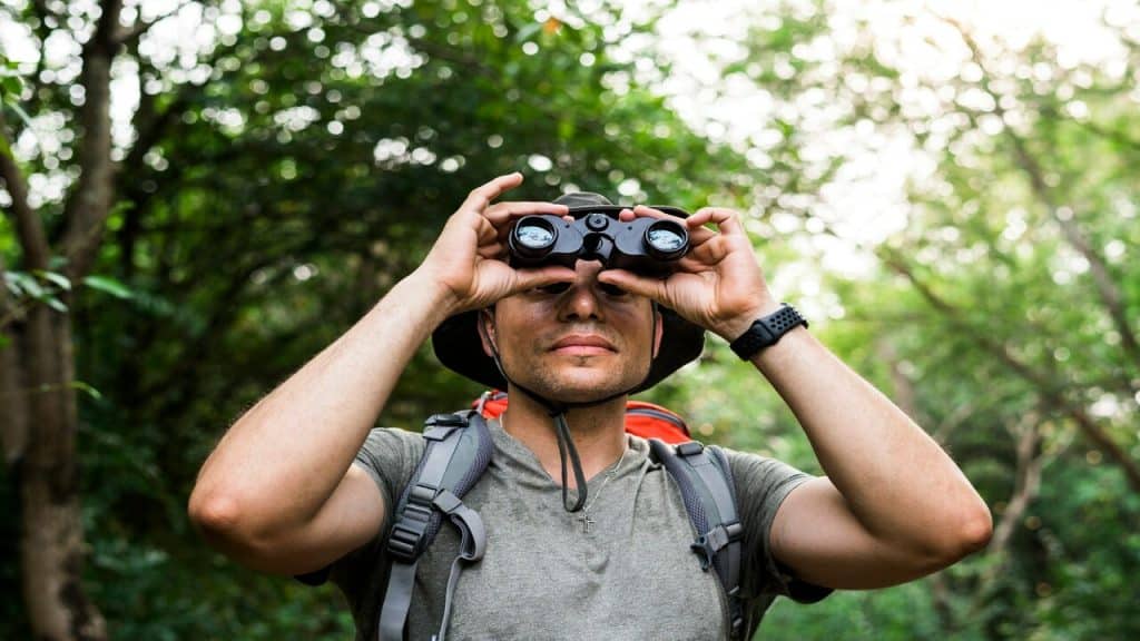 A man using binoculars.