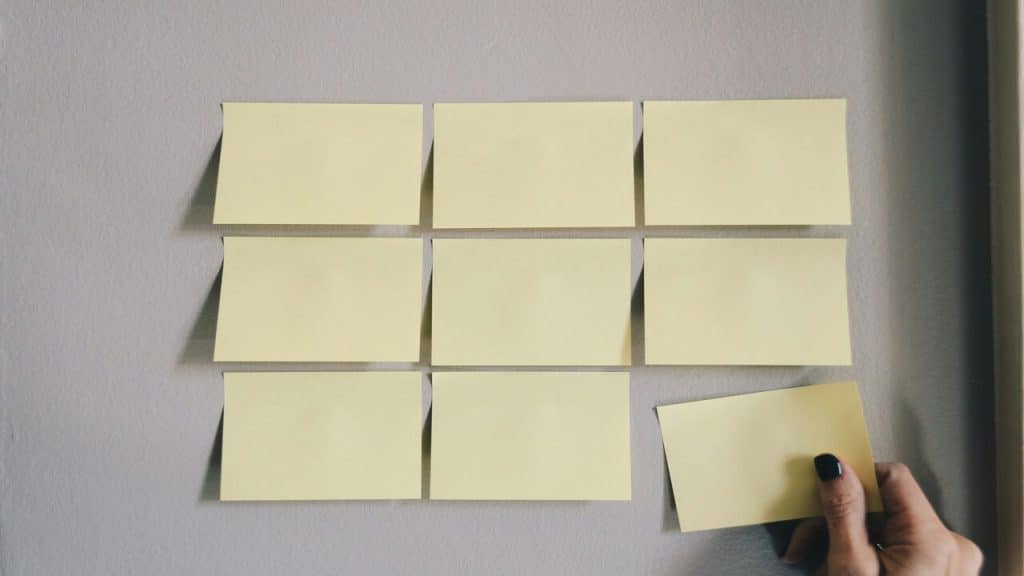 Yellow post-its on a wall.