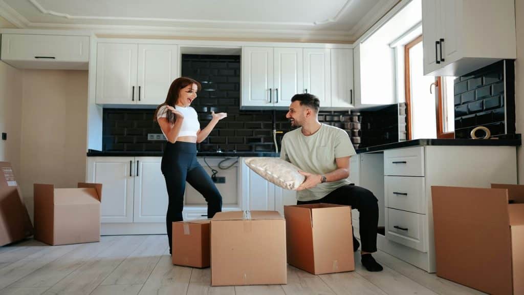 A man and a woman moving into a new home.