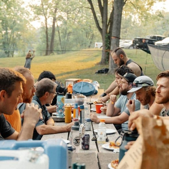 A group of men eating.