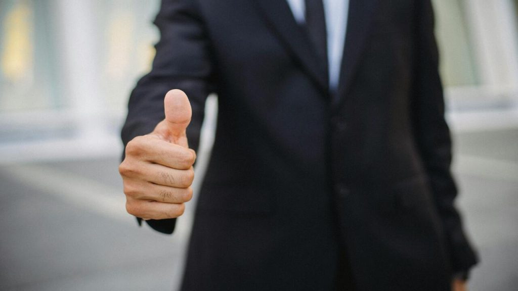 A man doing a thumbs up.