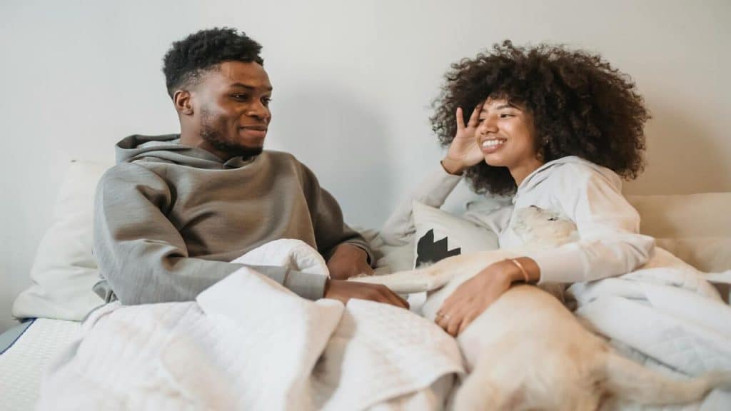 A couple talking at home.
