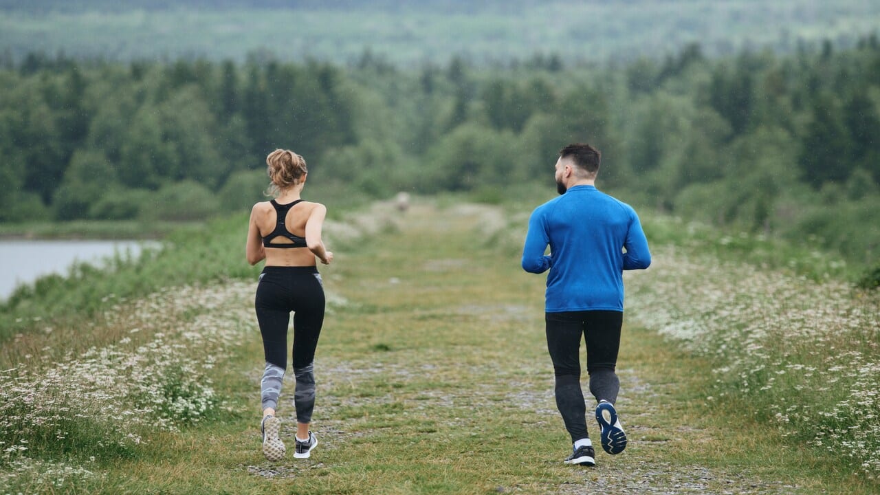 A couple jogging together.