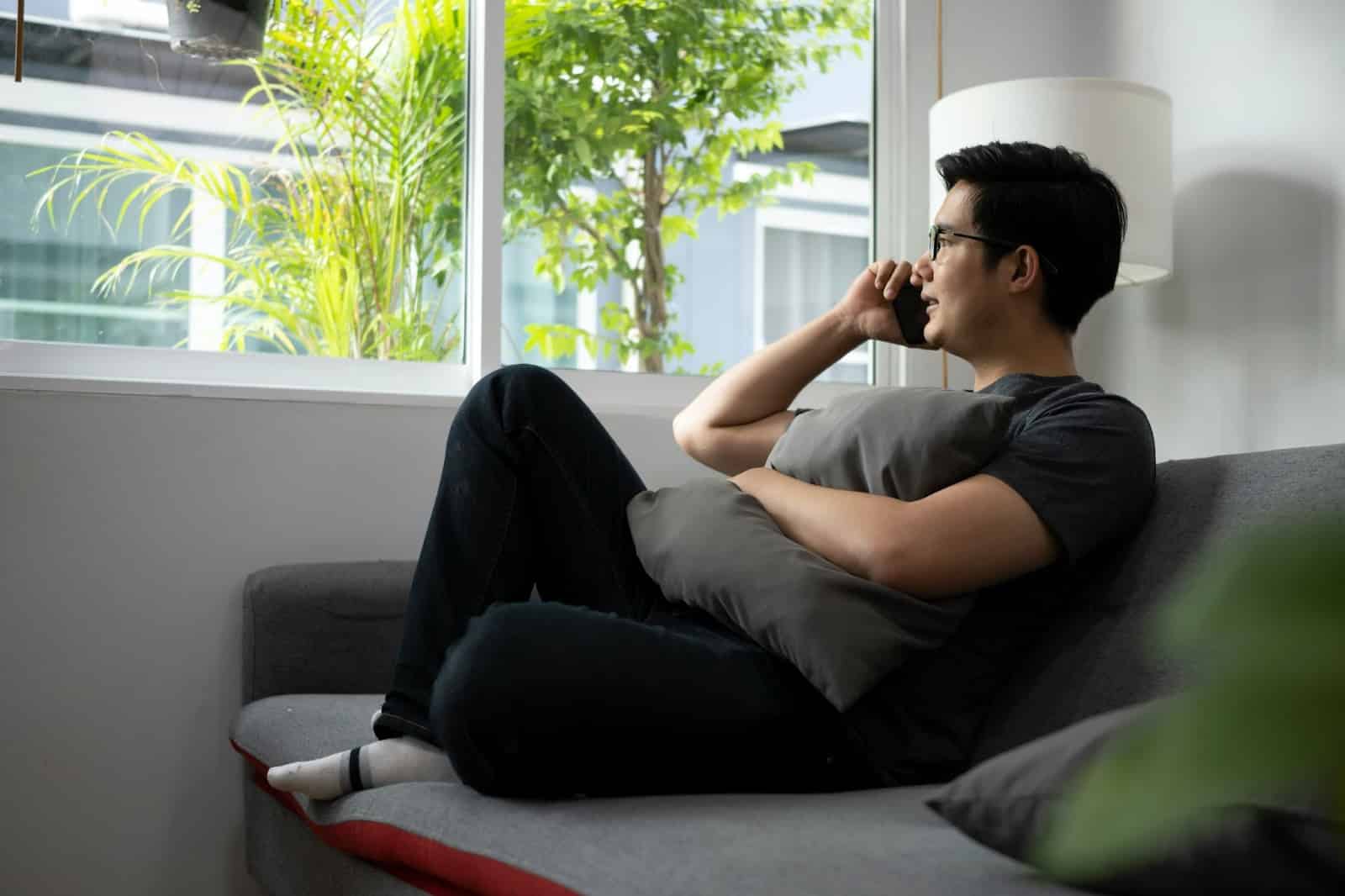 A man talking with someone on phone.