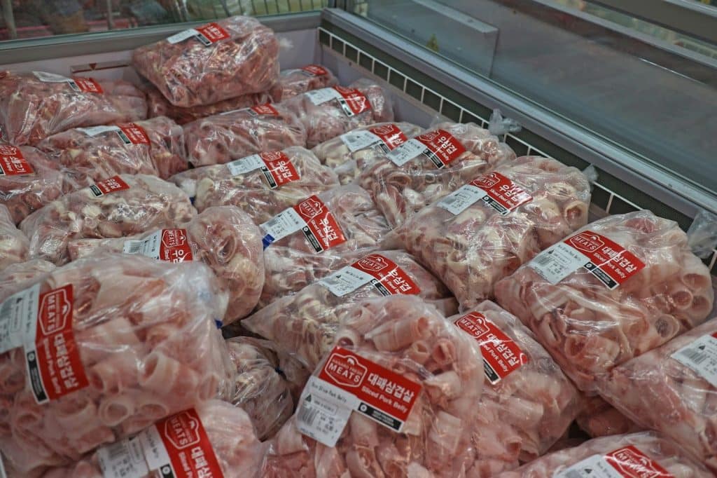 A picture of a processed meat wrapped in plastic.