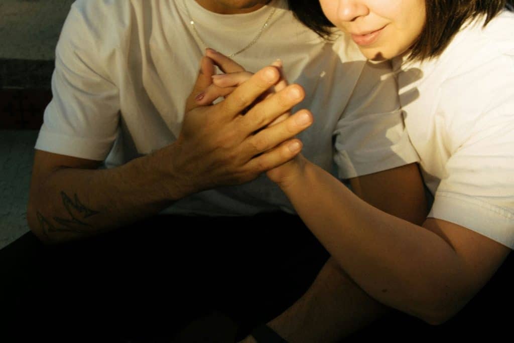 A woman leaning to his partner.